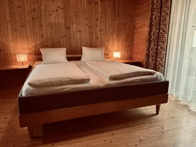 Ein Bett oder Betten in einem Zimmer der Unterkunft Dependance II