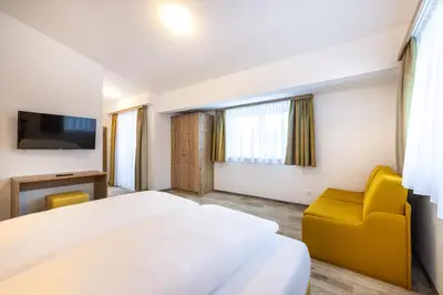 Ein Bett oder Betten in einem Zimmer der Unterkunft Der Alpenblick