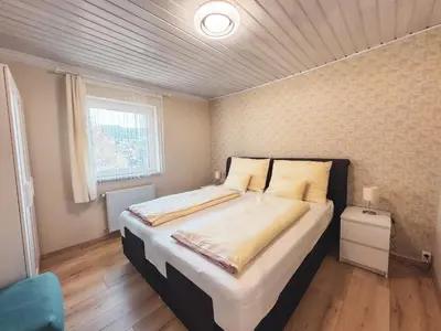 Ein Bett oder Betten in einem Zimmer der Unterkunft White Pearl Apartment