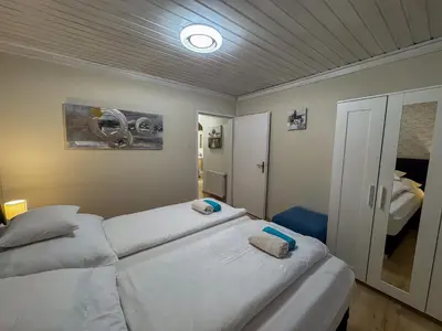 Ein Bett oder Betten in einem Zimmer der Unterkunft White Pearl Apartment