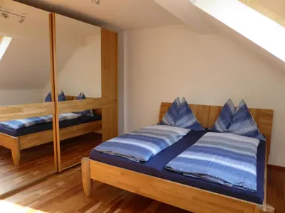 Ein Bett oder Betten in einem Zimmer der Unterkunft Luxusappartement Haus 157