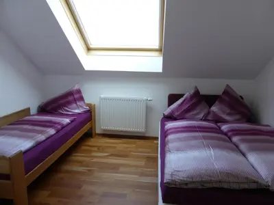 Ein Bett oder Betten in einem Zimmer der Unterkunft Luxusappartement Haus 157