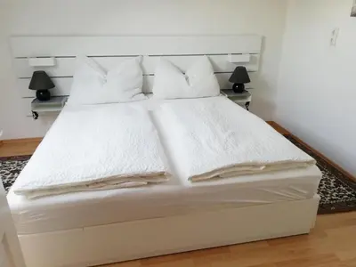 Ein Bett oder Betten in einem Zimmer der Unterkunft Apartment zur Schmiede - by myNests