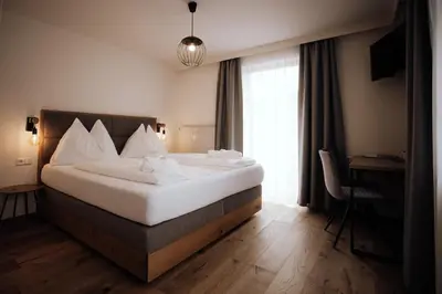 Ein Bett oder Betten in einem Zimmer der Unterkunft FORSTAUERWiRT Hotel & Restaurant