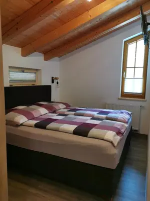 Ein Bett oder Betten in einem Zimmer der Unterkunft Ferienhaus Elisabeth