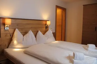 Ein Bett oder Betten in einem Zimmer der Unterkunft Ski In/Ski Out Ferienhaus Berghof by Schladmingurlaub