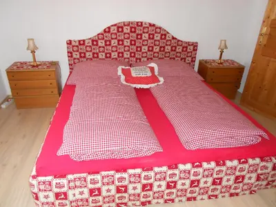 Ein Bett oder Betten in einem Zimmer der Unterkunft La vecchia Mesnerhaus