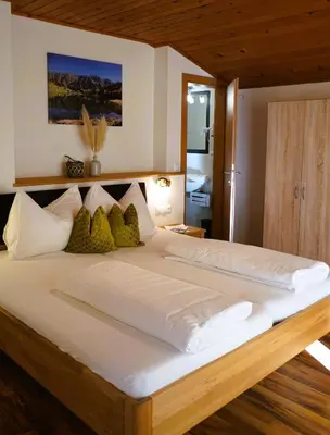 Ein Bett oder Betten in einem Zimmer der Unterkunft Bucheggerhof