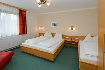 Ein Bett oder Betten in einem Zimmer der Unterkunft Ferienhaus Birkenweg