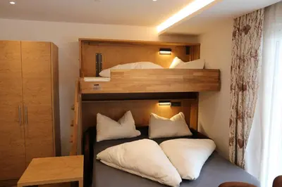 Ein Bett oder Betten in einem Zimmer der Unterkunft Alpenresidenz Hotel Gell