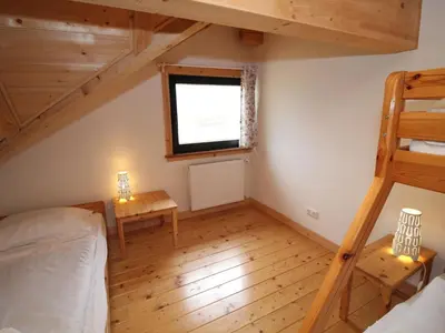 Ein Bett oder Betten in einem Zimmer der Unterkunft Apartment Bärenhöhle - Top 6 by Interhome