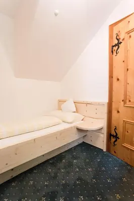 Ein Bett oder Betten in einem Zimmer der Unterkunft Ferienhaus zur Hackenschmiede