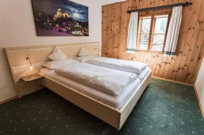 Ein Bett oder Betten in einem Zimmer der Unterkunft Ferienhaus zur Hackenschmiede