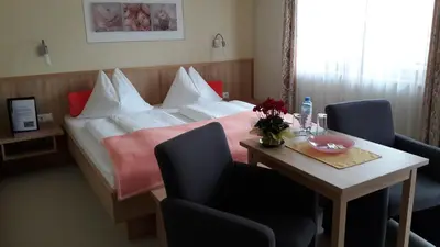 Ein Bett oder Betten in einem Zimmer der Unterkunft Pension Felsenheim