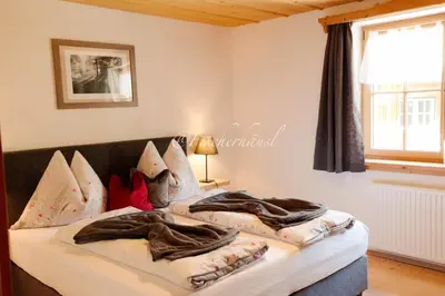 Ein Bett oder Betten in einem Zimmer der Unterkunft Fischerhaus Sankt Wolfgang Appartement 1
