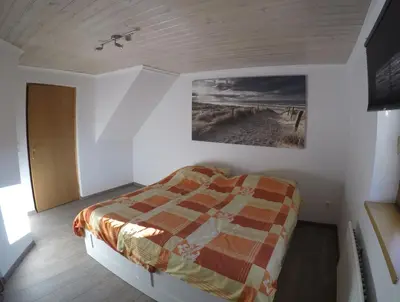 Ein Bett oder Betten in einem Zimmer der Unterkunft Haus Pistenblick
