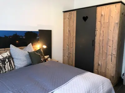 Ein Bett oder Betten in einem Zimmer der Unterkunft Am Holzmeisterweg 31 
