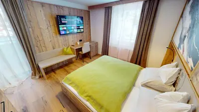 Ein Bett oder Betten in einem Zimmer der Unterkunft Smarthotel inAlpe
