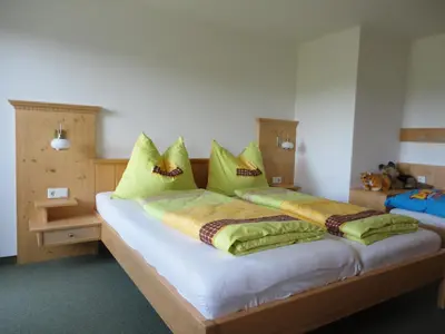 Ein Bett oder Betten in einem Zimmer der Unterkunft Bauernhof Strumegg