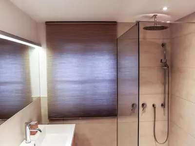 Ein Badezimmer in der Unterkunft Chalet Weissenbach by Interhome