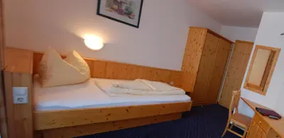 Ein Bett oder Betten in einem Zimmer der Unterkunft Pension Kristall