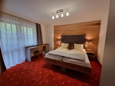 Ein Bett oder Betten in einem Zimmer der Unterkunft Pension Kristall