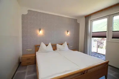 Ein Bett oder Betten in einem Zimmer der Unterkunft Apartments Luidold