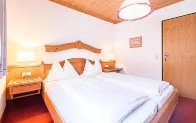 Ein Bett oder Betten in einem Zimmer der Unterkunft Haus am Platz - Weitgasser