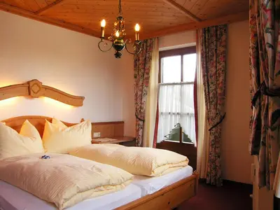 Ein Bett oder Betten in einem Zimmer der Unterkunft Haus am Platz - Weitgasser