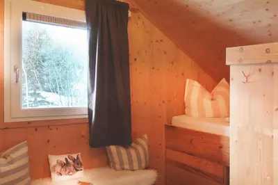 Ein Bett oder Betten in einem Zimmer der Unterkunft Chalet SCHNEEHASE 10min - Kreischberg