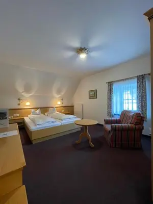 Ein Bett oder Betten in einem Zimmer der Unterkunft Landgasthof Santner