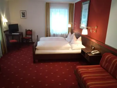 Ein Bett oder Betten in einem Zimmer der Unterkunft Landgasthof Santner