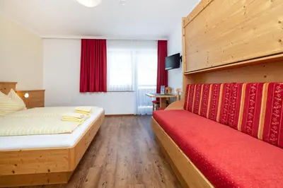 Ein Bett oder Betten in einem Zimmer der Unterkunft Gasthof Jandlalm