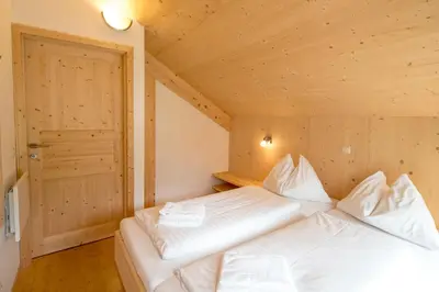 Ein Bett oder Betten in einem Zimmer der Unterkunft Aron Chalet Kreischberg 10A