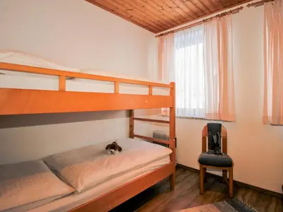 Ein Bett oder Betten in einem Zimmer der Unterkunft Apartment Edelweiss-1 by Interhome
