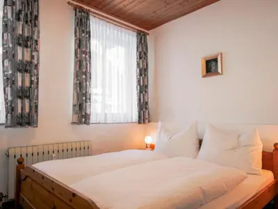 Ein Bett oder Betten in einem Zimmer der Unterkunft Apartment Edelweiss-1 by Interhome
