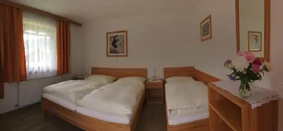 Ein Bett oder Betten in einem Zimmer der Unterkunft Ferienwohnungen Passrugger