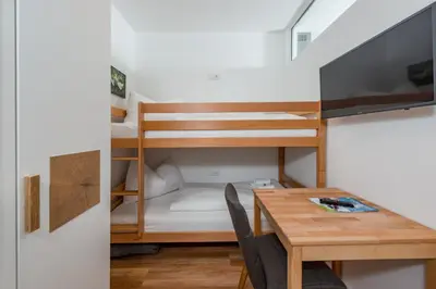 Ein Bett oder Betten in einem Zimmer der Unterkunft Appartement - das kleine Bleiberger by Schladmingurlaub