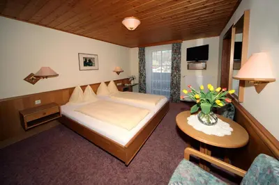 Ein Bett oder Betten in einem Zimmer der Unterkunft Pension Salzburger Hof