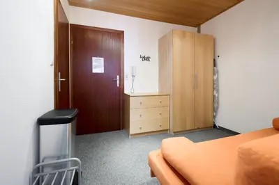 Ein Bett oder Betten in einem Zimmer der Unterkunft Alpina Holiday Living Zirbenstrasse