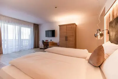 Ein Bett oder Betten in einem Zimmer der Unterkunft Rohrmooser Schlössl