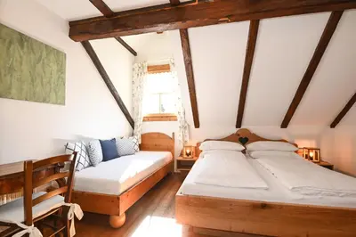 Ein Bett oder Betten in einem Zimmer der Unterkunft Auerhof