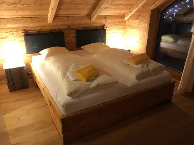 Ein Bett oder Betten in einem Zimmer der Unterkunft Lachtalchalet