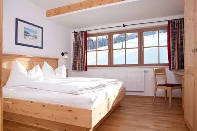 Ein Bett oder Betten in einem Zimmer der Unterkunft Sonnalm