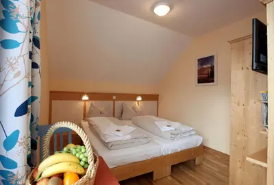 Ein Bett oder Betten in einem Zimmer der Unterkunft JUFA Hotel St Michael im Lungau