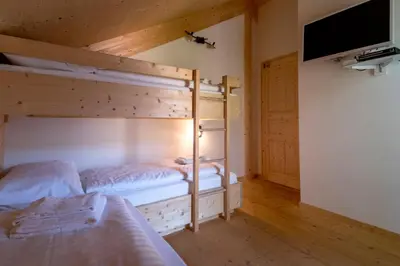 Ein Bett oder Betten in einem Zimmer der Unterkunft Luxury Chalet Kreischberg 11a