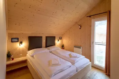 Ein Bett oder Betten in einem Zimmer der Unterkunft Luxury Chalet Kreischberg 11a