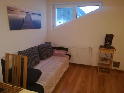 Ein Sitzbereich in der Unterkunft Ferienwohnung Lassing