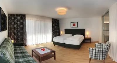 Ein Bett oder Betten in einem Zimmer der Unterkunft Hotel Hochsteg Gütl | Traunsee Salzkammergut