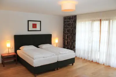 Ein Bett oder Betten in einem Zimmer der Unterkunft Hotel Hochsteg Gütl | Traunsee Salzkammergut